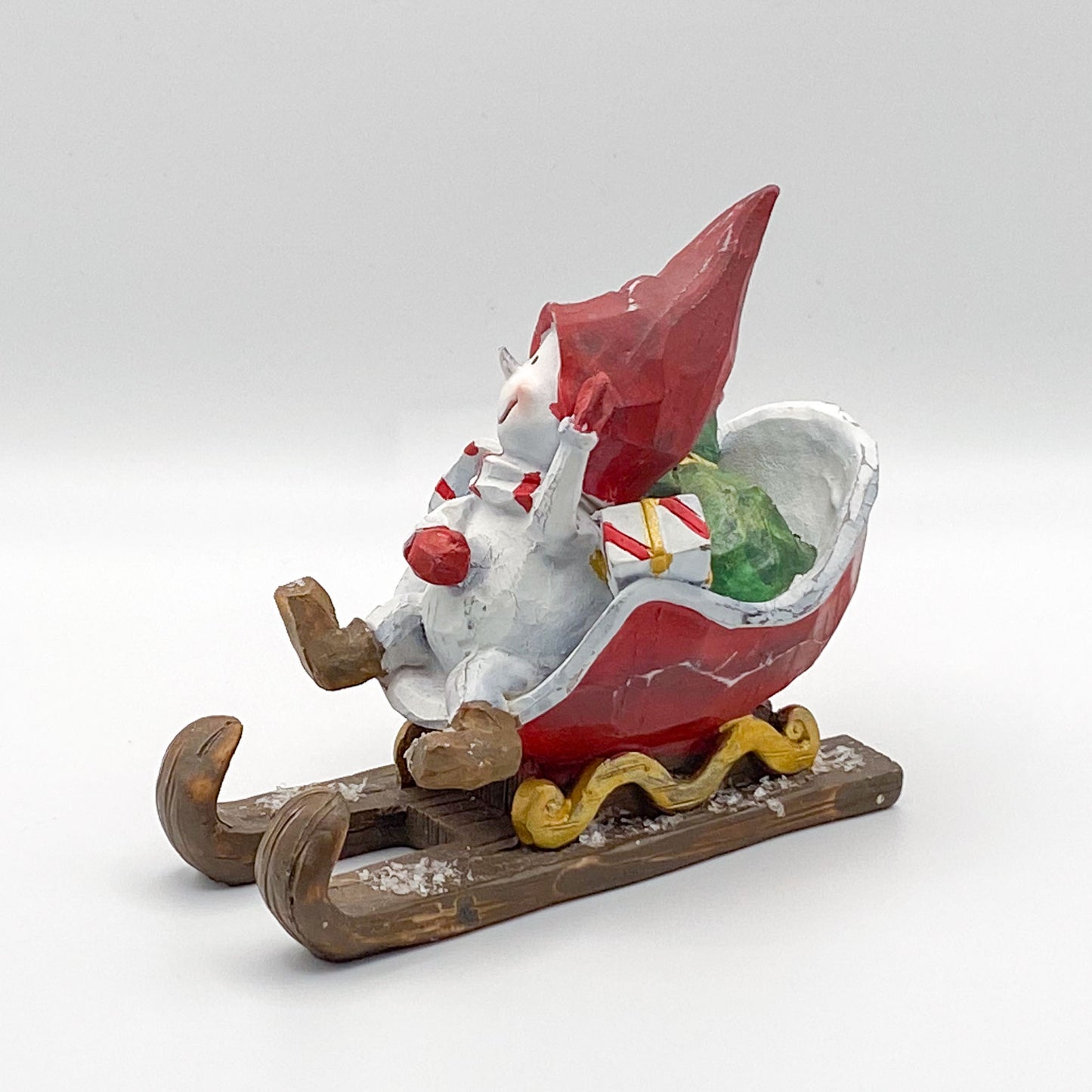 Figur: Schneemann spielt Weihnachtsmann