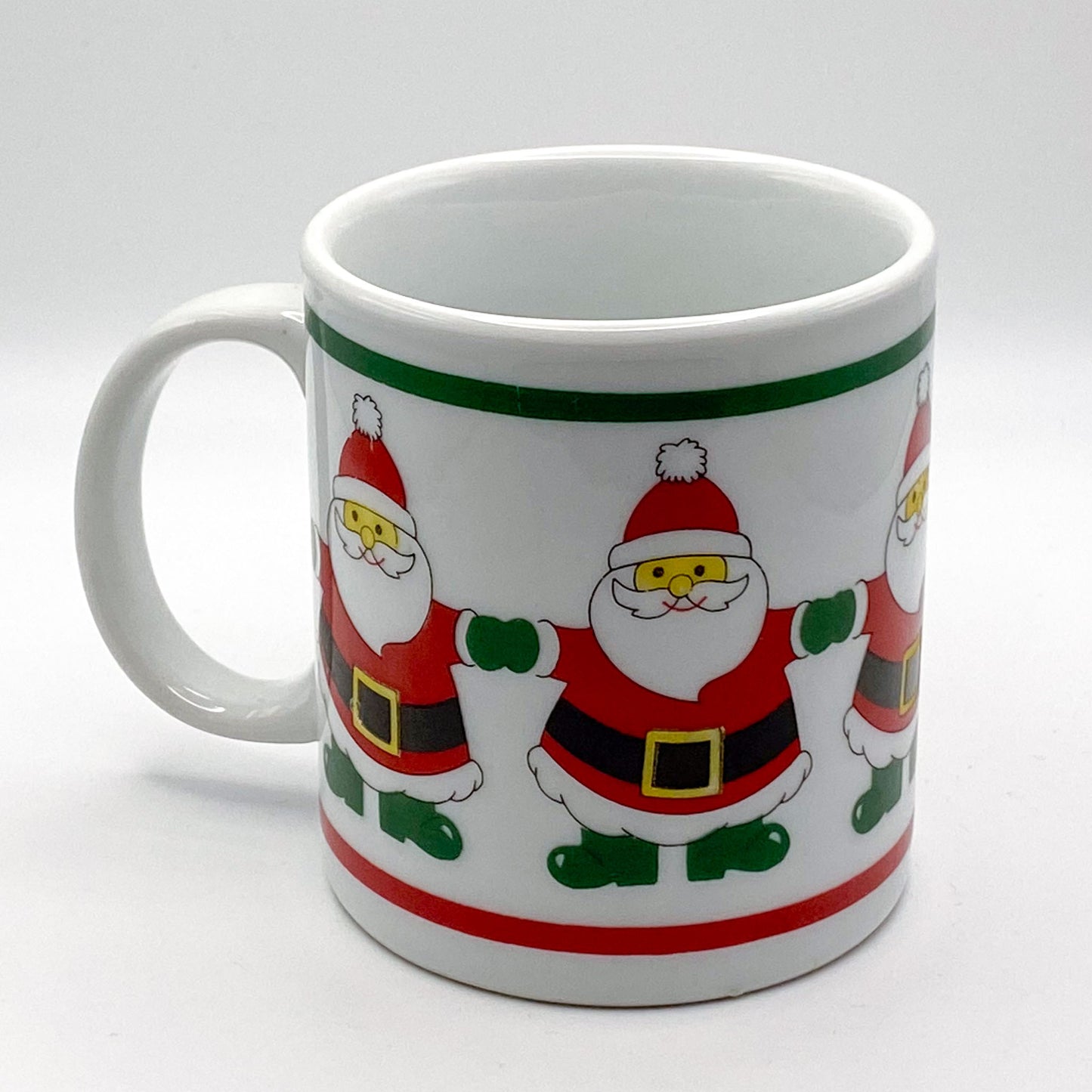 Becher - mit weihnachtlichem Motiv: tanzende Weihnachtsmänner