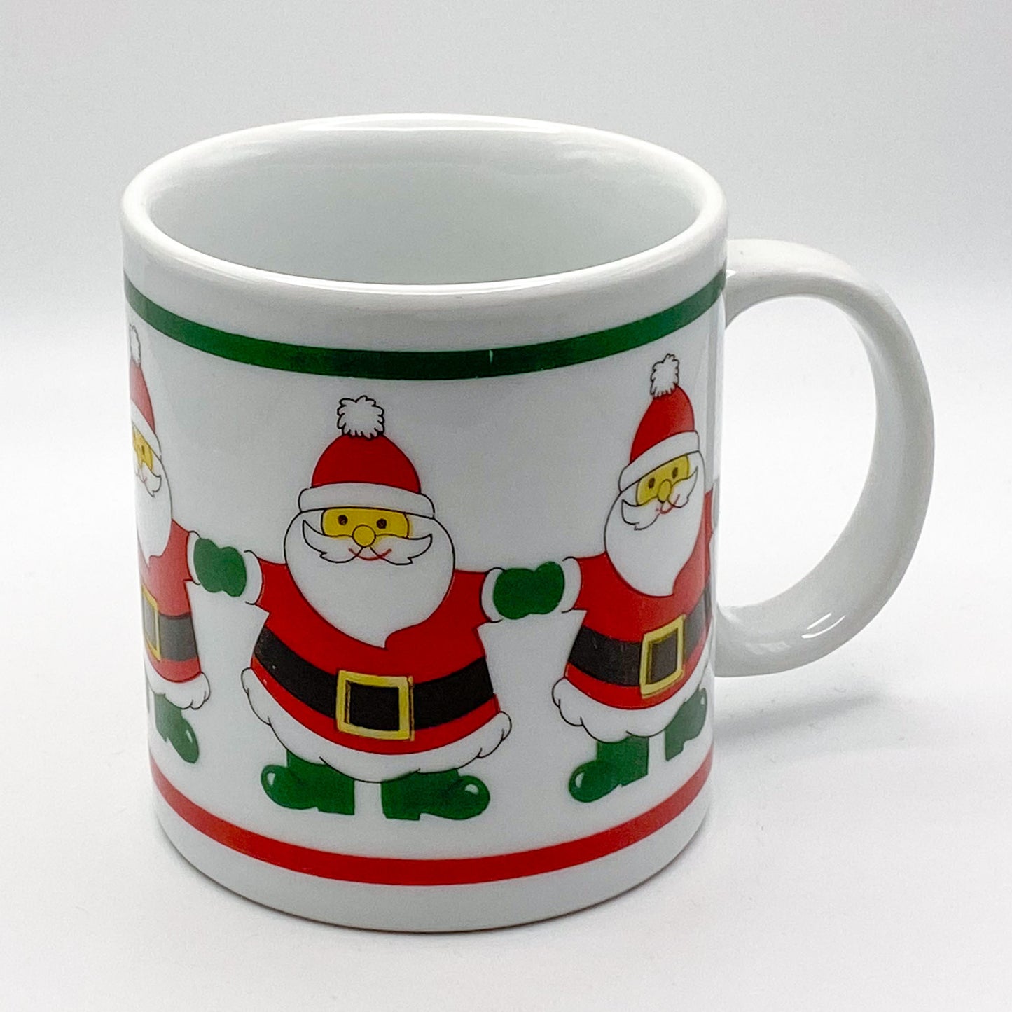 Becher -  mit weihnachtlichem Motiv: tanzende Weihnachtsmänner